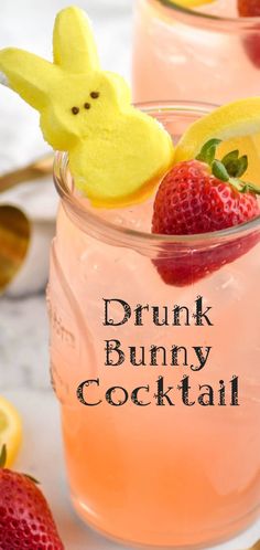 two glasses filled with pink lemonade and topped with peep - ear strawberries