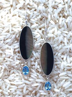 Black Lip Earrings Oval Medium w/ Dangle Oval Blue Topaz: WHOLESALE! $110 • Sterling Silver Black Lip Earrings Teardrop Medium w/ Dangle Oval Blue Topaz Oval Style Medium size 7x5mm Oval Blue Topaz Bezel Set Size: @ 12x38mm •  #BlackLipEarrings #BlackLipJewelry #BlueTopazJewelry #MartaHowell #MartaHowellJewelry #SilverShellJewelry #SterlingSilverJewelry Lip Earrings, Lip Jewelry, Designers Jewelry Collection, Designer Silver Jewellery, Abalone Earrings, Blue Topaz Jewelry, Jewelry Styles, Black Lips, Jewelry Catalog