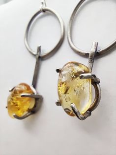 Textured and unique handmade sterling silver earrings with gorgeous citrine stone. Modern Amber Jewelry With Citrine, Modern Yellow Citrine Jewelry, Modern Amber Citrine Jewelry, Minimalist Yellow Sterling Silver Jewelry, Silver Citrine Drop Earrings, Silver Citrine Drop Earrings Jewelry, Handmade Round Citrine Earrings, Silver Citrine Earrings For Gift, Hand Forged Amber Sterling Silver Jewelry