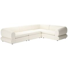 a large white sectional couch sitting on top of a white floor