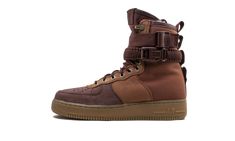 The Nike SF AF1 PRM introduces a special lining to the Special Field Boot - Air Force 1 hybrid to last throughout the winter months. Sturdy enough to battle the elements, the sneaker boot is composed of a suede and durable canvas construction with an all-brown tonal aesthetic. Double straps wrap around the ultra-high collar to secure the ankle. To keep the wearer extra warm, a fuzzy sherpa material lines the interior throat. Nike branding is minimal and the shoe is completed with a gum midsole a Nike Sf Air Force 1, Nike Sf Af1, Nike Sf, Nike Branding, Kicks Shoes, Punk Outfits, Stadium Goods, Future Fashion, Winter Months