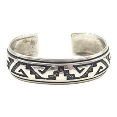 This is part of Chairish’s Costume Jewelry assortment.  Navajo Silversmith Rosita Singer's overlay  sterling silver cuff bracelet featuring a traditional Navajo pattern  The back is marked Singer Sterling.  Interior of the cuff measures 5 1/2" with an additional 1 " gap for a total circumference of 6 1/2".  Sterling Silver is relatively malleable, thus this cuff is slightly adjustable. Width measures 2.53" straight across the widest part (from wrist bone to wrist bone). Bracelet face measures .61" tall (the face of the bracelet, north to south). Bracelet depth from top the underside of wrist is 2". Traditional Inlay Cuff Bangle Bracelet, Traditional Adjustable Cuff Bracelet With Inlay, Traditional Adjustable Inlay Cuff Bracelet, Bohemian Silver Cuff Bracelet With Inlay, Silver Bohemian Cuff Bracelet With Inlay, Chunky Silver Jewellery, Bone Bracelet, Navajo Pattern, Sterling Silver Cuff Bracelet