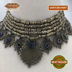 * This heavily embellished Afghani choker necklace is inspired by an antique style of ornaments. The rusty tones and glass stonework showcased over the piece is complimenting the whole design of the necklace. The exclusive ornament is handcrafted by the artisans of the Himalayan. The elegant craft is good to go with any traditional or trendy outfit, making you look beyond just good. Note: The product is handmade, slight change might occur in the actual product. Bohemian Gold Beads Choker, Bohemian Style Metal Layered Choker Necklace, Bohemian Gold Beads Choker As Gift, Bohemian Metal Layered Choker Necklace, Gold Metal Choker For Festivals, Gold Vintage Choker For Festivals, Vintage Gold Choker For Festivals, Bohemian Gold Beads Choker Necklace, Bohemian Gold Choker As A Gift