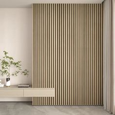 a living room with white furniture and wooden slats on the wall next to a plant