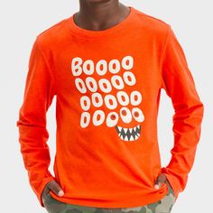 They can stay comfy while getting into the festive spirit with this Long-Sleeve Halloween Graphic T-Shirt from Cat & Jack™. The Halloween graphic tee features a casual crewneck, regular fit and a turnback hem. The soft cotton-blend jersey fabric and pullover style allows for easy wear. They can pair this top with their choice of bottoms to complete the cool look. Cat & Jack™: Designed for all children so you can trust it's made for yours. Playful Cartoon Print T-shirt For Fall, Fun Long Sleeve T-shirt With Screen Print, Orange Long Sleeve Graphic T-shirt, Orange Long Sleeve T-shirt With Graphic Print, Fun Long Sleeve Screen Print T-shirt, Fun Long Sleeve Fall T-shirt, Playful Long-sleeve T-shirt With Graphic Print, Playful Long-sleeved T-shirt With Graphic Print, Playful Orange Crew Neck Top