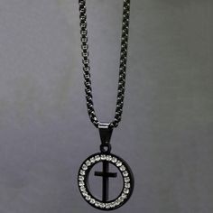 Classic yet contemporary, circle necklace with cross centerOpenwork design; black cross of stainless steel, encircled with sparkling stones23 black chainBlack cross; shimmering Christian jewelry accessory Black Cross Jewelry With Adjustable Chain, Black Cross Necklace With Chain, Black Cross Pendant Necklace With Chain, Black Metal Circle Necklaces, Black Metal Circle Necklace, Black Circle Metal Necklaces, Black Metal Circular Necklace, Black Circular Metal Necklace, Black Jewelry With Adjustable Chain And Cross Pendant