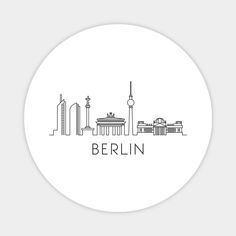 the berlin skyline in black and white on a round sticker, with the word berlin written