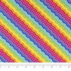 an image of a rainbow colored pattern on a white background, with a ruler in the foreground