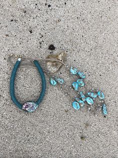 ~ Appx 39" long with a 2" extender ~ Lobster clasp closure ~ 3 strands of turquoise like beads ~ Glass like beads ** Handle with care Abalone Necklace, Handle With Care, High Tide, Green Crystal, Oval Pendant, Shell Pendant, Endless Summer, Green Crystals, The High