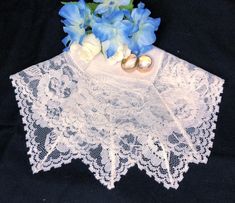 This lovely vintage lace handkerchief would make a lovely gift for your favorite bride, Bridesmaids, mother, grandmother or hostess.  Condition : Excellent vintage condition, no fraying, holes or tears.  Size : 10.5 inches square including the lace. The lace is 2 1/2 inches wide.   Smoke free home   All hankies hand washed, line dried and ironed.  Fabric note : Most of my hankies are nearly 70 years old and the fabric is quite delicate. Feel free to ask any questions.  Check the pictures carefully and use the zoom feature. Vintage pieces are rarely perfect and sometimes I miss a flaw. Elegant Lace Handkerchiefs With Lace Trim, Elegant Pink Wedding Handkerchiefs, Elegant Wedding Handkerchief With Lace Work, Elegant Lace Wedding Handkerchief, Elegant Lace Work Handkerchiefs Gift, Elegant Lace Work Handkerchief For Wedding, Elegant Lace Work Wedding Handkerchief, Lace Handkerchiefs With Lace Trim For Wedding, Lace Wedding Handkerchiefs With Lace Trim