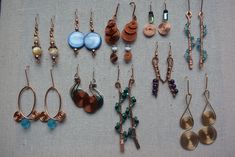 "I love working with beads and wire, and I love creating interesting and one-of-a-kind earrings! This listing features 10 (TEN) pairs of dangle/drop earrings. They are all different and made from a variety of wires and glass and/or gemstone beads.  I like to upcycle and re-use materials whenever I can and so some of the wire and beads used in these has been \"rescued\" from older or damaged pieces. The earrings in this lot are made from a variety of wires - copper, brass, and colored jewelry wir Wire Wrapped Beaded Earrings In Copper Wire For Gifts, Handmade Copper Wire Beaded Drop Earrings, Wire Bead Earrings, Colored Jewelry, Jewelry Wire, Handmade Wire, Handcrafted Earrings, Beads And Wire, Wire Earrings