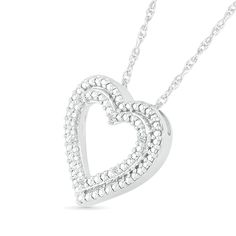 Plan to stand out with the romantic details of this diamond accent double heart pendant in sterling silver. Fashioned in sterling silver Beaded details line this open heart-within-a-heart design. Diamond accents add a hint of sparkle to the look. This pendant suspends along an 18.0-inch rope chain that secures with a spring-ring clasp. Silver Double Heart Diamond Necklace, Silver Double Heart Necklace With Diamond Accents, Diamond White Double Heart Diamond Necklace, White Gold Double Heart Necklace For Valentine's Day, Double Heart Diamond Cut Necklace, Diamond White Open Heart Jewelry, Anniversary Jewelry With Heart Beads In Open Heart Shape, Anniversary Jewelry With Open Heart Beads, Anniversary White Gold Jewelry With Heart Beads