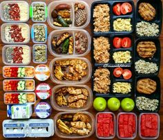 several plastic containers filled with food on top of a wooden table