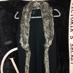 Sleeveless Cardigan With Faux Fur And Also Has Red/White Detailing At Bottom. Never Worn. Size Medium. Black Winter Vest For Night Out, Black Vest Outerwear For Night Out, Fitted Sleeveless Vest With Faux Fur Lining, Sleeveless Vest Outerwear For Night Out, Sleeveless Vest For Night Out In Winter, Heart Sweaters, Heart Sweater, Sleeveless Cardigan, Sweaters & Cardigans