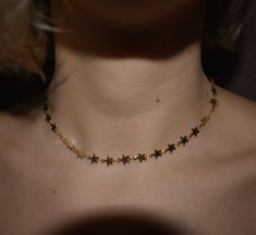 Simple & sweet star choker. One size fits all. About 12.5in-16in adjustable. If you are concerned with the size feel free to leave your measurements when you check out. Necklace is made of gold plated copper. Water, lotion, fragrances, sweat (any kind of moisture) can cause discoloration. Shipped with minimal packaging to avoid unnecessary waste. ♥️🌎 Check out our hanging stars choker here: https://etsy.me/2HiGzhi Check out our star gemstone here: https://etsy.me/31pUk68 Check out out our s Trendy Adjustable Jewelry With Star Charm, Trendy Star Charm Choker, Adjustable Dainty Star Jewelry, Trendy Adjustable Star-shaped Necklace, Trendy Adjustable Star Necklaces, Star-shaped Clavicle Chain Choker Gift, Star Print Jewelry As A Gift, Trendy Star Charm Choker As Gift, Trendy Choker With Star Charm For Gift