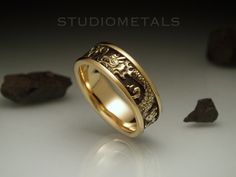 An intricately, hand carved Asian dragon wedding ring in solid 14K gold with a comfort fit interior. Unusual and unique, this unisex wedding band is comfortable and substantial. * Handmade in 14K yellow gold with an oxidized finish to show detail. * 7mm wide and approximately 1.9mm thick. * Approximate weight of 8.5 grams. * Size 8. * Comfort fit interior. * Ready to ship! Shipped with FedEx Express with tracking and a signature required for delivery. The band will come to you nicely packaged and presented in high quality ring box. We can also make this ring inn different sizes. If you have any questions, please feel free to get in touch with us! Visit our shop for more creative and high quality jewelry: https://www.etsy.com/ca/shop/Studiometals Studiometals is the two of us! All of our pi Dragon Wedding Ring, Dragon Wedding, Dragon Chino, Cool Rings For Men, Ring Cuts, Beautiful Wedding Bands, Viking Wedding, Asian Dragon, Animal Ring