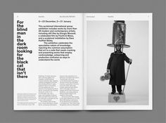 an open magazine with a man in a top hat holding a lamp on his head