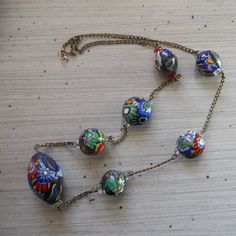 Hey, I found this really awesome Etsy listing at https://www.etsy.com/listing/210030724/vintage-murano-millefiori-beaded Vintage Glass Necklace With Oval Beads, Vintage Glass Necklaces With Oval Beads, Vintage Multicolor Single Strand Necklace, Vintage Multicolor Necklace With Spacer Beads, Vintage Necklace With Colorful Oval Beads, Vintage Colorful Oval Beaded Necklaces, Multicolor Vintage Necklace With Spacer Beads, Vintage Colorful Oval Bead Necklaces, Retro Necklaces With Large Round Beads