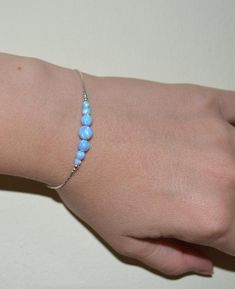 Simple and delicate yet ultra stylish 14k Gold Filled bracelet with blue opal beads bar. This can be a perfect gift for you or your loved one! M a t e r i a l s Your bracelet can be made of the following materials: Sterling Silver or 14k Gold Filled. Please select material during checkout process. M e a s u r e m e n t s - Available bracelet lengths: 6, 6.5, 7, 7.5, 8 inches - The length of the entire bracelet is measured from end to end - Model on the pics wears 7 inches bracelet P a c k a g i Gold Bracelet Simple, Jewelry Opal, Bead Bar, Bracelet Simple, Bar Bracelet, Opal Beads, Opal Bracelet, Bar Bracelets, Opal Jewelry