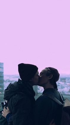 two people kissing each other in front of a window with the words alter love on it