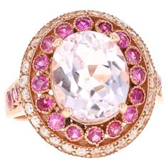 5.92 Carat Kunzite Pink Sapphire Diamond 14 Karat Rose Gold Ring This beautiful ring has an Oval Cut 4.53 Carat Kunzite that is set in the center of the ring and is surrounded by 22 Round Cut Pink Sapphires that weigh 0.93 Carats. Additionally there are 30 Round Cut Diamonds that weigh 0.46 Carats (Clarity: SI2, Color: F). The total carat weight of the ring is 5.92 Carats. The ring is made in 14K Rose gold and weighs approximately 5.6 grams. The ring is a size 7 and complimentary ring sizing is available upon request. Luxury White Multi-stone Gemstones, Luxury Gia Certified White Sapphire Ring, Classic White Oval Ruby Ring, Luxury White Ruby Ring With Brilliant Cut, White Sapphire Multi-stone Diamond Ring, White Diamond Gemstones In Fine Jewelry Style, Fine Jewelry White Diamond Gemstones, White Ruby Ring With Brilliant Cut, Luxury White Sapphire Gemstone Ring