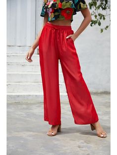 The EMES SHOP pants are detailed with a fun drawstring waist detail that is easily adjustable for your comfort. Features a palazzo style silhouette. solid color. and slant pockets. Style it with a halter cropped top for a dazzling look this season.MATERIAL:100% Soft Poly MEASUREMENTS:Trousers length 40"-42"in Small |Waist: 26"-28"in |Hip: 38"-40"in Medium|Waist: 28"-30"in |Hip: 40"-42"in Large|Waist: 30"-32"in |Hip: 42"-44"in XL |Waist: 32"-34"in |Hip: 44"-46"in