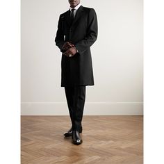 Alexander McQueen's classic trench coat is minimally detailed with the signature harness strap at one shoulder. It's been tailored in Italy from warm wool-twill and has a slim fit that layers well over collared shirts and lightweight sweaters. Solid Formal Fitted Wool Coat, Formal Fitted Wool Coat In Solid Color, Formal Fitted Wool Coat, Fitted Solid Wool Coat For Formal Occasions, Solid Color Fitted Wool Coat For Formal Occasions, Timeless Formal Outerwear With Concealed Placket, Classic Structured Boning Outerwear For Work, Modern Outerwear With Structured Boning For Formal Occasions, Designer Fitted Outerwear For Business