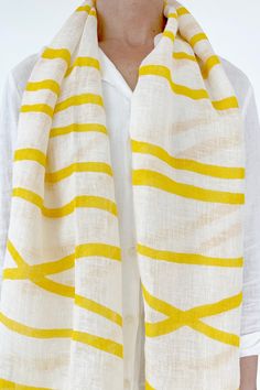 Our linen scarf is the perfect way to bring a splash of color into your wardrobe! Our linen is crafted for comfort and durability, and the colorful patterns will brighten up any outfit. Soft and lightweight, you can wear your scarf for any occasion! These 100% soft, linen scarves measure 28 by 70 inches and add a modern design element to any outfit. Dry-clean recommended. White Spring Scarves For Vacation, White Scarves For Spring Vacation, Casual Linen Scarves For Summer, White Scarf For Spring Vacation, Casual Yellow Summer Scarves, Casual Yellow Scarf For Spring, Casual White Beach Scarf, Bohemian Linen Scarves For Spring, White Beach Scarf For Spring