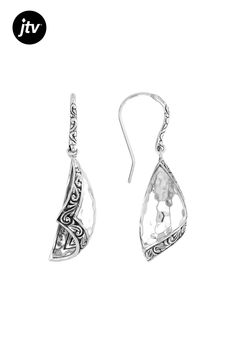 Introducing the Sterling Silver Hammered Earrings from our exclusive Artisan Collection of Bali���! These unique earrings are handcrafted with meticulous detail, featuring a stunning oxidized finishing technique that adds depth and character to each piece. The sterling silver material shines beautifully, making these earrings versatile for everyday wear or special occasions. With dimensions of 1.62 inches in length and 0.42 inches in width, they make a bold yet elegant statement on your ears. Th Elegant Engraved Metal Earrings, Elegant Metal Earrings With Oxidized Finish, Ornate Teardrop Earrings With Oxidized Finish, Elegant Oxidized Metal Earrings, Artistic Oxidized Finish Jewelry, Elegant Sterling Silver Earrings With Oxidized Finish, Elegant Oxidized Sterling Silver Earrings, Elegant Oxidized Finish Drop Earrings, Formal Silver Earrings With Oxidized Finish