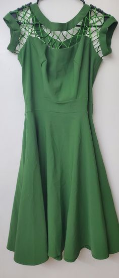 Green 50s style flare dress. Elegant Sleeveless Dark Green Mini Dress, Elegant Dark Green Sleeveless Mini Dress, Green A-line Midi Dress, Fitted Dark Green Mini Dress For Date Night, Chic Dark Green Mini Dress For Spring, Chic Dark Green Mini Dress, Fitted Dark Green Dress For Date Night, Green A-line Mini Dress For Date Night, Dark Green Fitted A-line Dresses