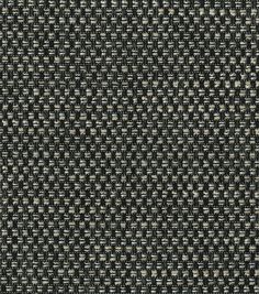 an upholstered black and white fabric textured with small, square dots or squares