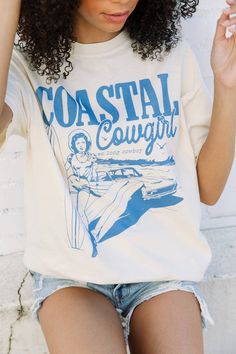 Coastal Cowgirl Tee Western Style Screen Print Tops For Summer, Retro Summer T-shirt For Rodeo, Retro Summer Rodeo T-shirt, Western Style Cotton Tops With Screen Print, Retro Screen Print Tops For Rodeo, Western Style Cotton T-shirt For Rodeo, Trendy Cotton T-shirt For Rodeo, Vintage Relaxed Fit Tops For Rodeo, Western Style Cotton T-shirt For Country Concerts