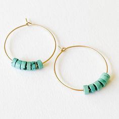 "A lovely pair of 14K Gold Filled hoops with Genuine Turquoise beads  The hoops measure 1\" (25mm).  Shipped in a gift box. Details: 14K gold-filled hoops Genuine Turquoise stones 1\" Handmade in our Burlington VT studio." Minimalist Turquoise Hoop Earrings For Gifts, Minimalist Turquoise Hoop Earrings As Gift, Small Turquoise Hoop Earrings For Everyday, Everyday Turquoise Hoop Earrings, Handmade Minimalist Turquoise Hoop Earrings, Turquoise Wire Wrapped Hoop Earrings, Turquoise Small Hoop Jewelry For Everyday, Simple Gold Hoops, Burlington Vt