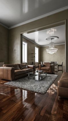 a living room filled with furniture and a chandelier