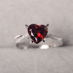 ◆ The ring is handcrafted from sterling silver and decorated with a dazzling 8*8 mm Garnet and CZs. It is suitable for engagement/anniversary/daily occasion. ◆ Production Description: Main stone Type: Garnet Main Stone Shape: Heart Cut Main Stone Size: 8*8 mm(2.44ct) Side stone: CZ Metal: 925 Sterling silver - Other options available in the drop down menu ◆ Customization: √Free for Add Engraving √Other Metal Type Available √Other Gemstones & Shapes Available √Personalization Requests Availab Moissanite Heart Cut Diamond Ring For Proposal, Heart Cut Moissanite Diamond Ring For Proposal, Heart Cut Diamond White Ring For Proposal, Round Cut Ruby Ring With Accent Stones For Anniversary, Moissanite Heart Cut Ring With Halo Setting, Heart Cut Moissanite Ring With Halo Setting, Classic Ruby Cubic Zirconia Promise Ring, Solitaire Ruby Ring For Promise, Diamond Heart Ring With Prong Setting For Proposal