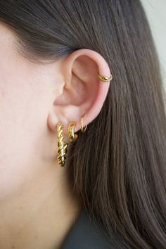 You'll want to sweep your hair high and let your cartilage show with our snake hoop earring.  Material: 316L Surgical steel OR 316L Surgical steel + quality PVD tarnish-resistant plating Gauge: 16g (1.2 mm) Size (length/diameter): 8mm (standard size) OR Size (length/diameter): 10mm  Most suitable for: Cartilage, daith, rook, nose hoop, septum, earlobe  How to put on/remove: Hinged clicker hoop, making it easy to take on and off ** This item is final sale due to hygienic purposes we cannot accept Trendy Hoop Ear Cuff With Piercing, Trendy Hypoallergenic Hoop Ear Cuff, Trendy Single Hoop Cartilage Earring, Internally Threaded Hoop Huggie Earrings, Spiral Ear Cuff, Helix Hoop Earring, Helix Earrings Hoop, Helix Hoop, Cartilage Earrings Hoop