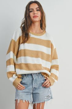 Stay stylish and cozy with our Striped Round Neck Long Sleeve Sweater. Crafted with comfort in mind, this sweater features a classic round neckline and long sleeves to keep you warm during chilly days. The charming striped pattern adds a touch of timeless flair to your wardrobe, making it a versatile piece for casual outings or relaxed days at home. Made from soft, high-quality fabric, this sweater offers both comfort and style, making it a must-have addition to your collection. Cozy Striped Sweater For Layering, Cozy Striped Ribbed Sweater, Cozy Striped Sweater For Fall, White Long Sleeve Sweater With Horizontal Stripes, Striped Sweater With Ribbed Cuffs For Winter, Casual Long Sleeve Striped Sweater, Winter Striped Sweater With Ribbed Cuffs, Striped Crew Neck Sweater For Winter, Striped Long Sleeve Knit Sweater