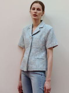 Editor's Notes Soft and structured, this short sleeved tweed jacket has notched lapels and hidden button details. Fitted waist accentuates the classic and feminine mood. - Linen and cotton blend summer tweed fabric- Natural, standard silhouette- Slim fitting waist design- Casual front pockets- Versatile styling and easy layeringMeasurements(in.)Size One Size(XS-M)- Length: 21.65 in - Shoulder: 16.93 in - Bust: 18.90 in - Sleeve: 7.87 in - Hem: 20.87 in * Model info: Height 5' 5 Bust 31 Waist 25 Hip 35 / Height 5' 7 Bust 31 Waist 24 Hip 36.5Composition & Care- 10% Linen, 65% Cotton, 25% Rayon - Dry Cleaning only - Do not bleach / Do not tumble dry Designer- by Et demain Classic Tailored Short Sleeve Blazer, Short Sleeve Single Breasted Blazer For Office, Tailored Short Sleeve Spring Blazer, Spring Tailored Short Sleeve Blazer, Short Sleeve Tailored Blazer For Spring, Classic Short Sleeve Outerwear For Formal Occasions, Classic Short Sleeve Outerwear For Formal Events, Classic Short Sleeve Spring Blazer, Spring Short Sleeve Tailored Blazer