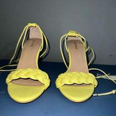 A Stylish Sandal With A Sharp Heel, Braided Strap And Lace-Up Design. Add To Any Outfit To Level Up Your Look. Yellow Sandals With 4-inch Heel For Summer, Yellow Synthetic Heels With Heel Loop, Summer Synthetic Heels With 4-inch Heel, Spring Lace-up Sandals With Padded Heel, Synthetic Open Toe Lace-up Sandals With 4-inch Heel, Yellow Sandals With 4-inch Heel For Spring, Summer Lace-up Sandals With Padded Heel, Yellow Synthetic Sandals With 4-inch Heel, Summer Yellow Heels, Medium Width