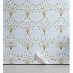 an art deco wallpaper design with gold scallops on a pale blue background