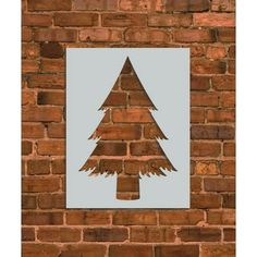 a brick wall with a christmas tree cut out on it