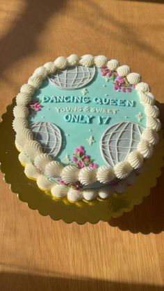 a cake sitting on top of a wooden table