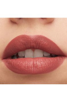 What it is: An iconic lipstick that has been maxed out to give lips more with a silky-matte finish and good-for-lips formula.What it does: The formula looks richer, feels better and lasts longer. Get more color with full-coverage, pigment-rich payoff in our widest range of 39 artist-approved shades. Get more comfort with a creamy blend of coconut oil, organic shea butter and organic cocoa butter that conditions and nourishes lips. Get more care with instant and eight-hour moisture. Get more longwear with 12 hours of nonfading, long-lasting color that leaves looking visibly fuller from the very first ultra-vibrant glide. Get a more luxe look with a high-shine packaging design on the outside. The iconic matte lipstick changed the world we live in may have been reimagined, but each famous and Rusty Red Lipstick, Best Bridal Lip Color, Lipstick For Light Skin Tone, Dark Peach Lipstick, Peachy Brown Lipstick, Elegant Lipstick Colors, Berry Lipstick For Fair Skin, Lipstick For Blue Eyes, Soft Summer Red Lipstick