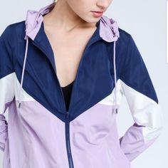 Color Block Windbreaker Jacket 100% Polyester Lilac/ Navy Color Combo Spring Nylon Color Block Outerwear, Trendy Purple Hooded Outerwear, Purple Hooded Outerwear For Spring, Fall Purple Nylon Windbreaker, Purple Hooded Sports Outerwear, Casual Purple Nylon Outerwear, Purple Long Sleeve Windbreaker For Fall, Spring Purple Long Sleeve Windbreaker, Blue Athleisure Outerwear With Color Block