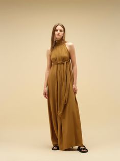 Imagine a dress that effortlessly blends comfort with a captivating wow factor. This statement piece features a flowy silhouette and eye-catching detailing. Crafted in soft, natural, breathable fabric, it can be worn in two ways, adding to its versatility. Available in a variety of colours and print. PRODUCT DETAILS Halter neck design Long maxi dress Versatile wear: can be worn in two ways, either loose or tight around the lower bust Loose fit or wraparound style Bump friendly Low back (elasticated at the back for seamless comfort) Long bow detail at the back for added elegance and style Designed in Australia Soft and light natural fabric Made with ecovero CONSIDERED NATURAL FABRIC Made with Lenzing EcoVero fabric, an eco-friendly sustainable material. EcoVero fabric has a very soft hand f Sale Campaign, Long Bow, Natural Clothing, Natural Fabric, Wow Factor, Boho Bride, Soft Natural, Bohemian Wedding, Long Maxi