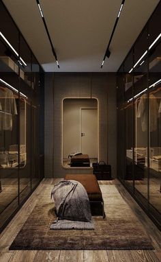 a bedroom with mirrored closet doors and a bed in the middle on top of a rug