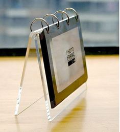 a photo frame sitting on top of a wooden table