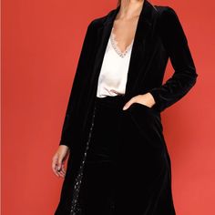 Elevate Your Layers With The Drama Of This Velvet Duster. Soft And Plush With A Lustrous Sheen, It's Got Notched Lapels, An Open Placket, And Welt Pockets At The Front. Notched Lapels Open Front Placket Welt Pockets Long Sleeves Elegant Winter Outerwear For Date Night, Elegant Winter Blazer For Date Night, Elegant Black Outerwear For Date Night, Party Blazer With Pockets In Black, Party Black Blazer With Pockets, Winter Long Sleeve Blazer For Date Night, Elegant Long Coat For Night Out, Elegant Party Outerwear With Pockets, Chic Winter Outerwear For Date Night