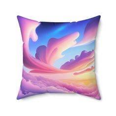 a pillow with an image of the sky and clouds painted on it's side