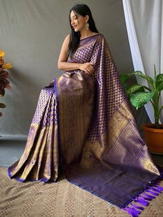 Get simplicity and grace with this mystic purple kanjivaram silk trendy saree. The brilliant attire creates a dramatic canvas with amazing weaving used in this handloom work with small motifs all over the saree and jacquard weaving border work. This lovely kanjivaram silk purple color saree is paired with a similar color blouse in silk material with zari border work. This pretty purple woven silk festival wear saree is 5.50 meters long and comes with 1.00 mtr blouse material. Celebrate your upco South Indian Saree Look, Indian Saree Look, South Indian Saree, Small Motifs, Purple Weave, South Indian Sarees, Trendy Sarees, Saree Shopping, Indian Saree